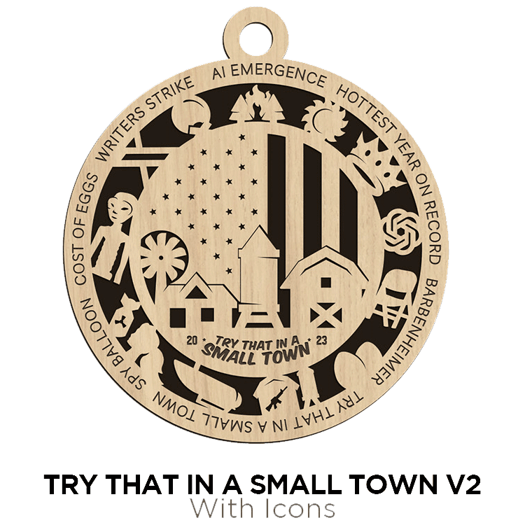 A wooden ornament with intricate designs and text, including "try that in a small town v2" with icons reflecting a rural community theme from Brothers DooDads.