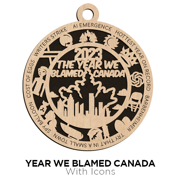 Laser-cut wooden ornament with various icons and text stating "2012 the year we blamed Canada from Brothers DooDads.